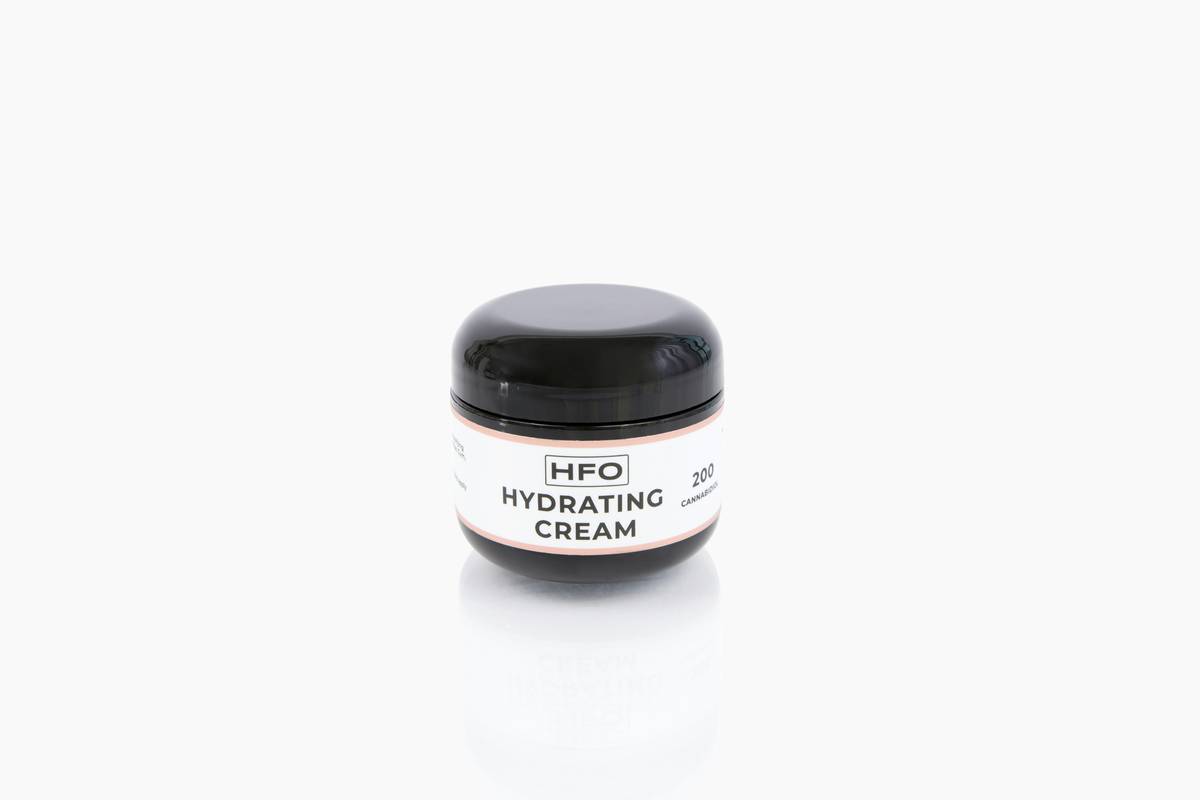 Close-up of oil based body lotion texture in glass jar with natural ingredients